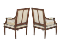 Pair of early 20th Century French Louis XVI Revival open armchairs in the Neo-Classical style.