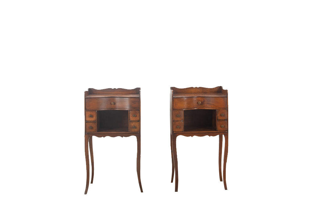 Pair of early 20th century french  walnut chevets in the Louis XV style with each end table having a galbé front with 5 drawers and a recessed shelf.