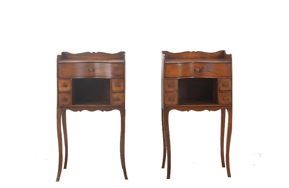 Pair of early 20th century french  walnut chevets in the Louis XV style with each end table having a galbé front with 5 drawers and a recessed shelf.