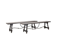 Pair of large Spanish oak benches with unusual turned legs and decorative wrought iron stretchers.