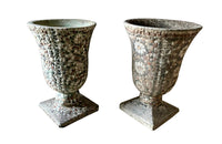 Decorative near pair of 20th Century French pebble mosaic planters.
