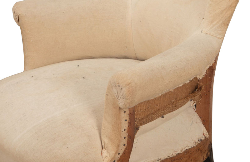 Pair of unusual Napoleon III armchairs with fish tail shaped backs and terminating on ebonised feet.