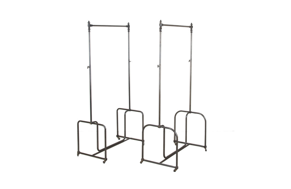 Fabulous near pair of 20th Century French iron clothes rails.