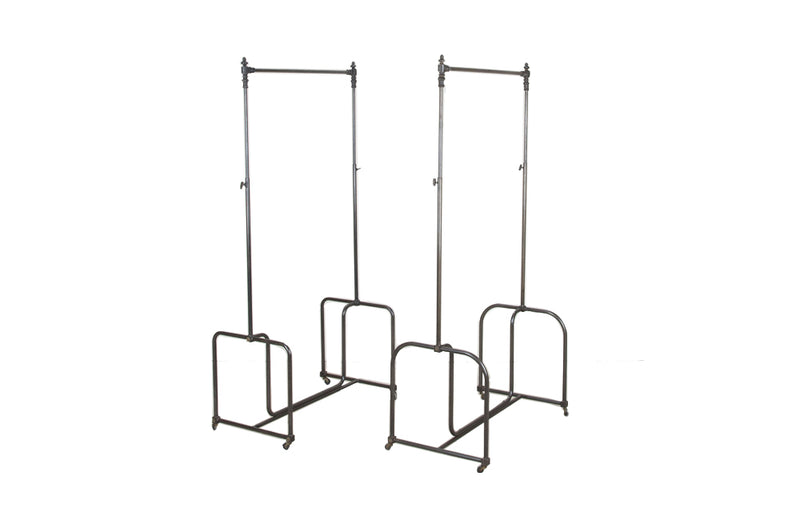 Fabulous near pair of 20th Century French iron clothes rails.