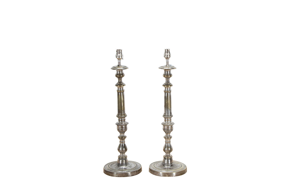 Lovely pair of large French 19th century worn silverplate candlesticks converted to table lamps.