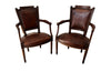 Elegant pair of 20th Century French comfortable worn leather armchairs in the Louis XVI style.