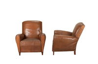Elegant pair of small leather 20th Century French club chairs.