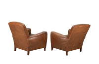 Elegant pair of small leather 20th Century French club chairs.