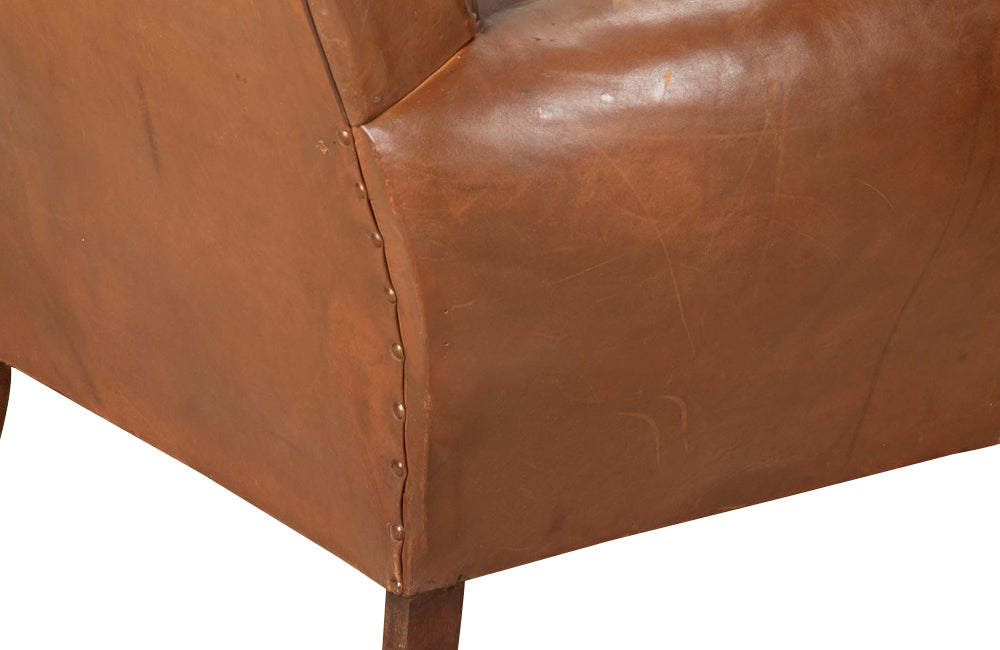 Elegant pair of small leather 20th Century French club chairs.