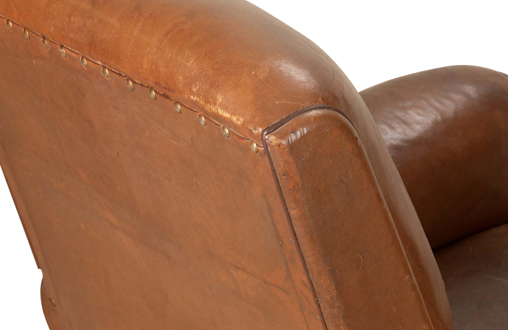 Elegant pair of small leather 20th Century French club chairs.