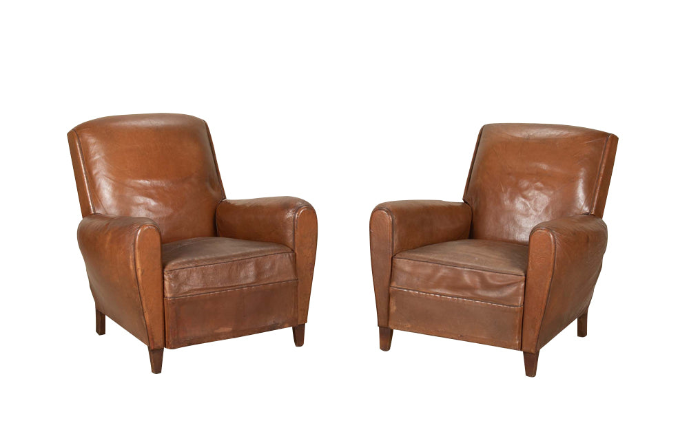 Elegant pair of small leather 20th Century French club chairs.