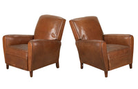 Elegant pair of small leather 20th Century French club chairs.