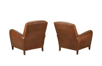 Elegant pair of small leather 20th Century French club chairs.