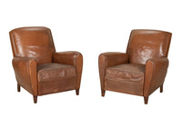 Elegant pair of small leather 20th Century French club chairs.