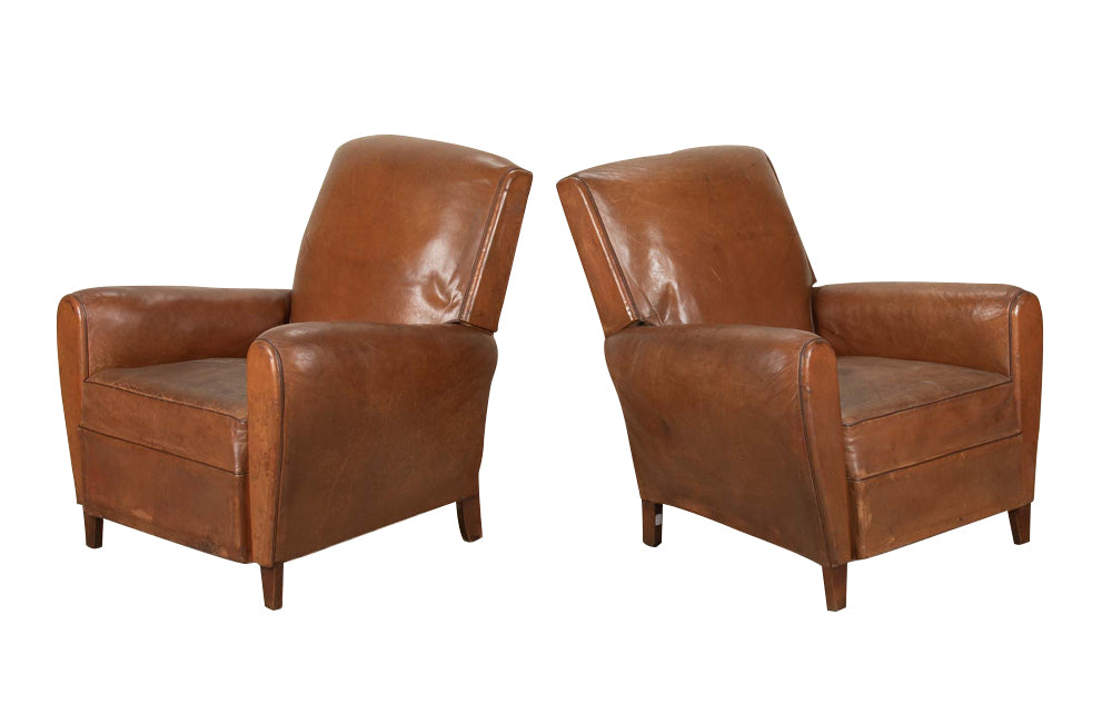 Elegant pair of small leather 20th Century French club chairs.