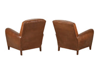 Elegant pair of small leather 20th Century French club chairs.