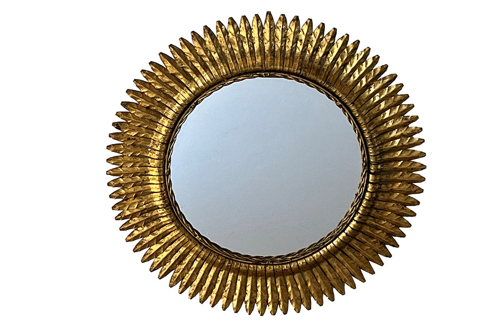round gilt iron mirror in the form of a sun. Spain c.1970