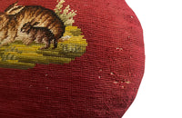 Charming cushion fashioned from a 19th Century French handstitched needlepoint depicting a rabbit and kit.