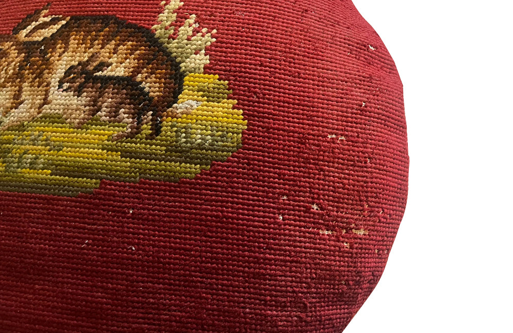 Charming cushion fashioned from a 19th Century French handstitched needlepoint depicting a rabbit and kit.