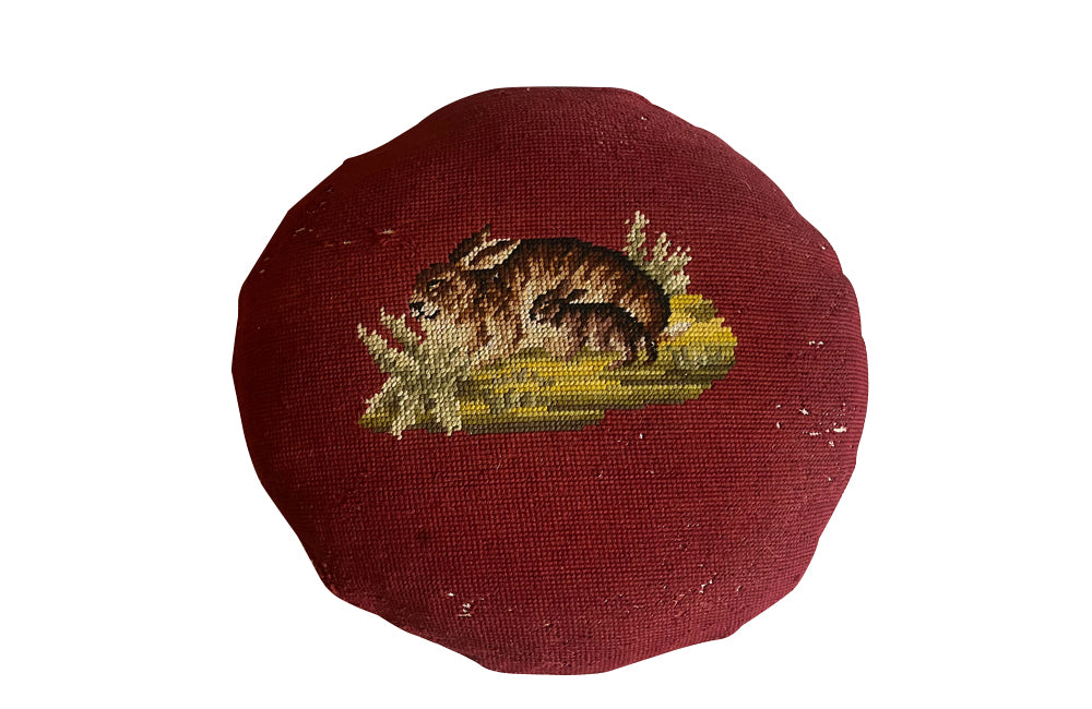 Charming cushion fashioned from a 19th Century French handstitched needlepoint depicting a rabbit and kit.