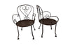 set of four French antique wrought iron garden chairs, comprising two armchairs and two chairs. Each has lovely scrolled ironwork and pierced iron seats. Circa 1900