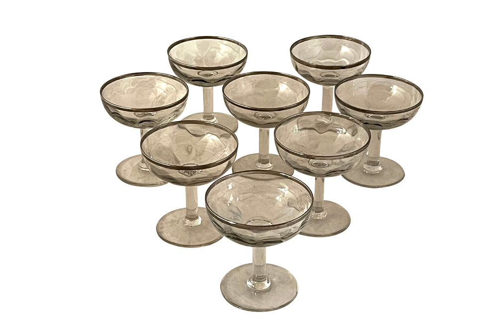 Elegant set of eight French hand blown champagne cups with silver rims circa 1920