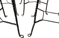 An elegant set of four mid-20th Century French wrought-iron folding chairs of the 'Bouchon de Champagne' type.