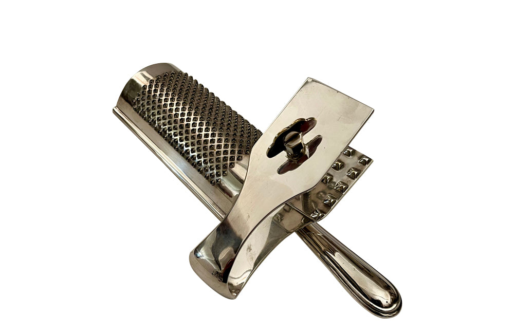 Elegant Mid-Century silver plate cheese clamp and grater set.