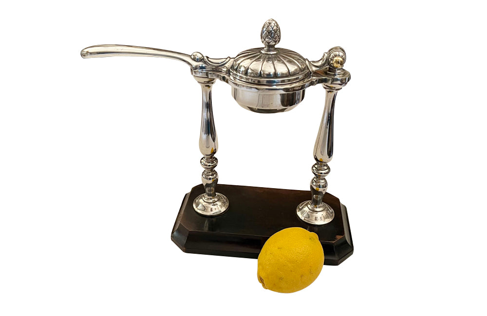 Elegant 20th Century French silver plated citrus press.