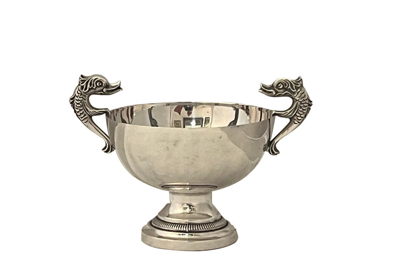 Decorative silver plate bowl with dolphin handles on raised foot and stamped with makers mark B.R. 