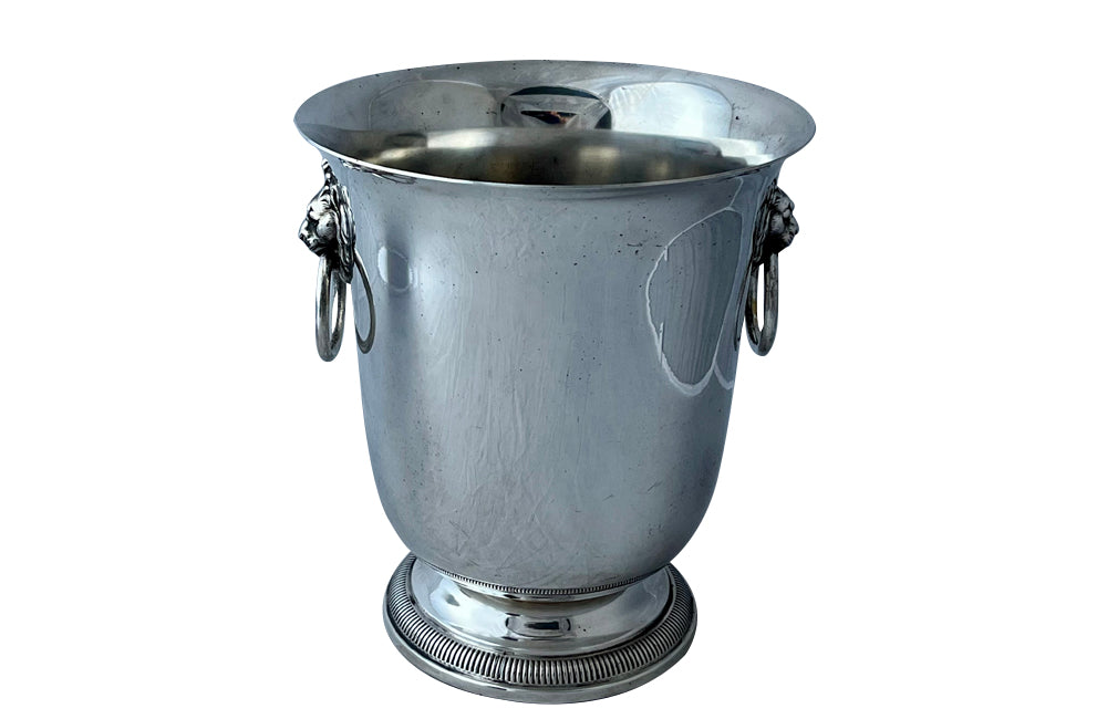 Elegant 20th Century French silver plate champagne bucket or wine cooler with lions head ringed handles.