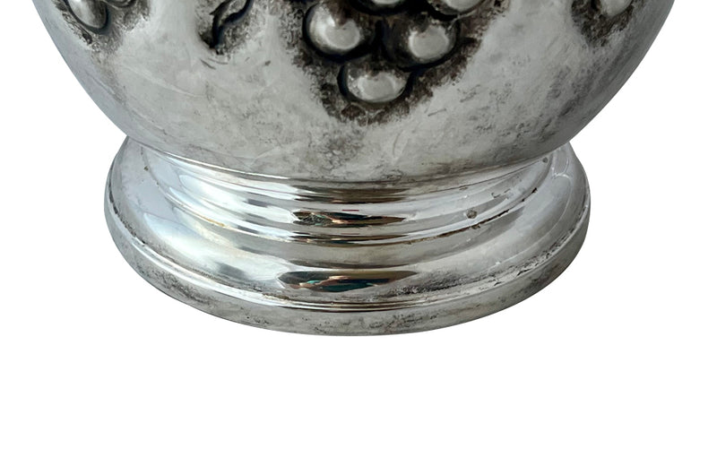 Mid-Century French silver plate decorative champagne bucket with embossed fruiting grape vine decoration.