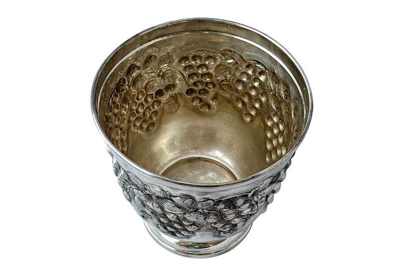 Mid-Century French silver plate decorative champagne bucket with embossed fruiting grape vine decoration.