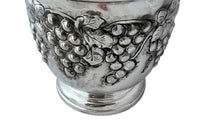 Mid-Century French silver plate decorative champagne bucket with embossed fruiting grape vine decoration.