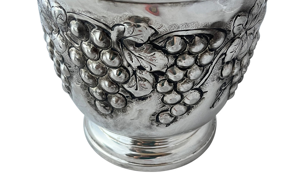 Mid-Century French silver plate decorative champagne bucket with embossed fruiting grape vine decoration.