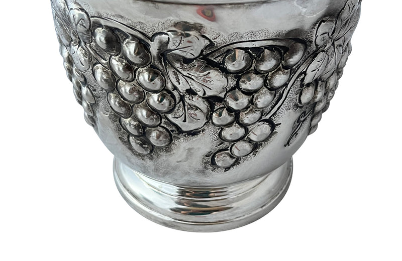 Mid-Century French silver plate decorative champagne bucket with embossed fruiting grape vine decoration.