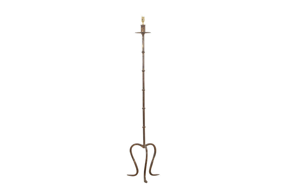 Mid 20th century Spanish gilt iron floor lamp with ring stem terminating on curved tripod base with arrow point feet.