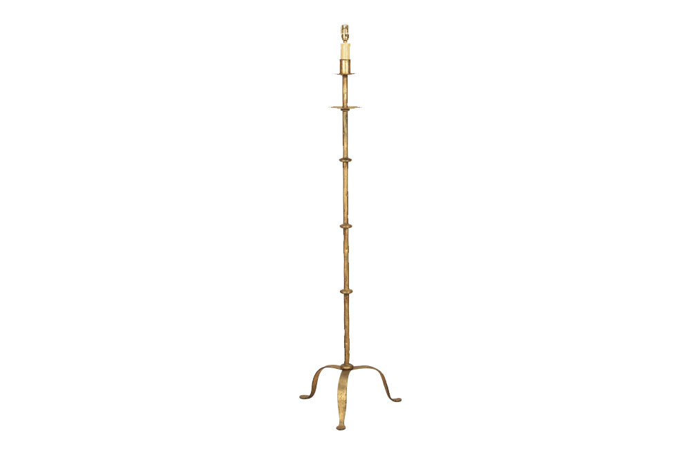 Mid century floor lamp gilt iron with ringed decorative stem on a tripod. Spanish. Mid century lighting