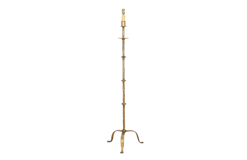 Mid century floor lamp gilt iron with ringed decorative stem on a tripod. Spanish. Mid century lighting