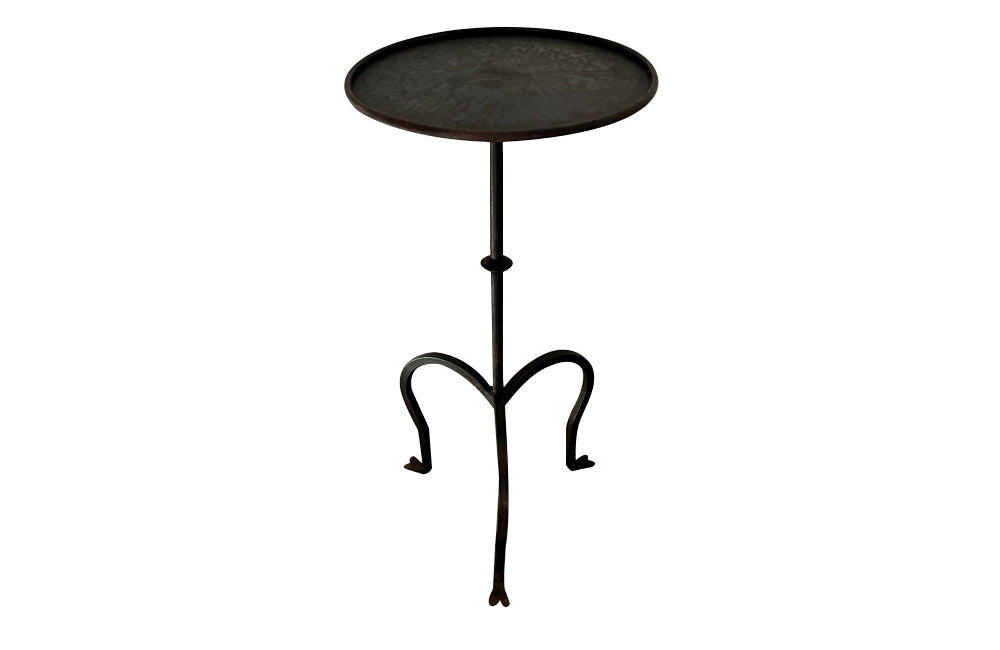 Chic little Mid-Century Spanish iron cocktail or martini table with raised rim to top.