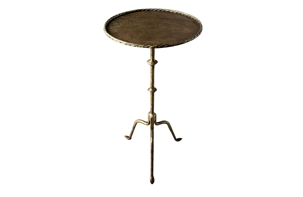 Chic little Mid-Century Spanish iron cocktail or martini table with rope rim to top.