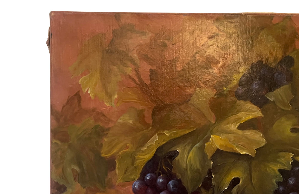 Large French still life painting of grapes and a champagne filled glass coupe.