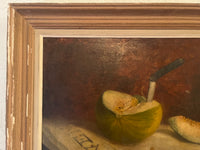 Signed French still life oil on canvas painting of a table with tablecloth and a freshly cut melon