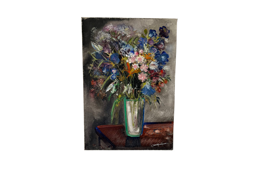 20th Century French unframed oil on canvas painting of a colourful bouquet of wildflowers in a glass vase signed by the artist L. Nuequelman 
