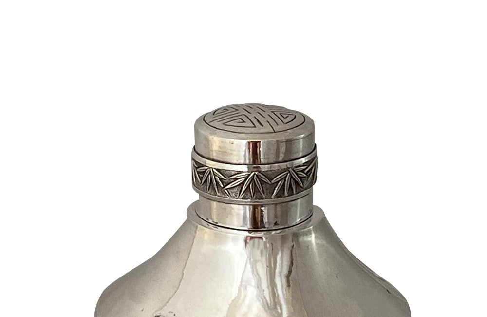 Beautiful silver plate Vietnamese cocktail shaker decorated with village scenes including fishing and
agricultural depictions