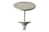round iron based table with tripod base featuring Satyr masques and lions paw feet. with marble top. 