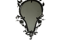 Pretty wrought iron mirror with floral and foliate decoration circa 1900