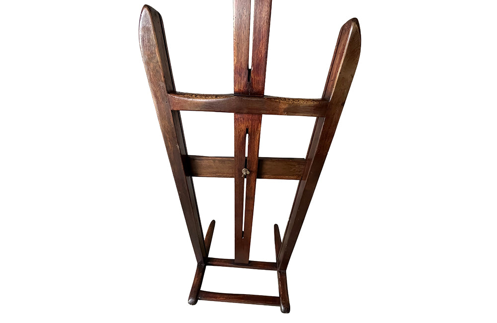 Charming rustic easel with sliding height adjustable shelf .