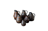 collection of six coopered wooden wine pitchers from the Burgundy region of France. Late 19th Century.