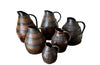 collection of six coopered wooden wine pitchers from the Burgundy region of France. Late 19th Century.